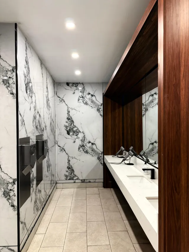 Marble washroom vanity with modern fixtures