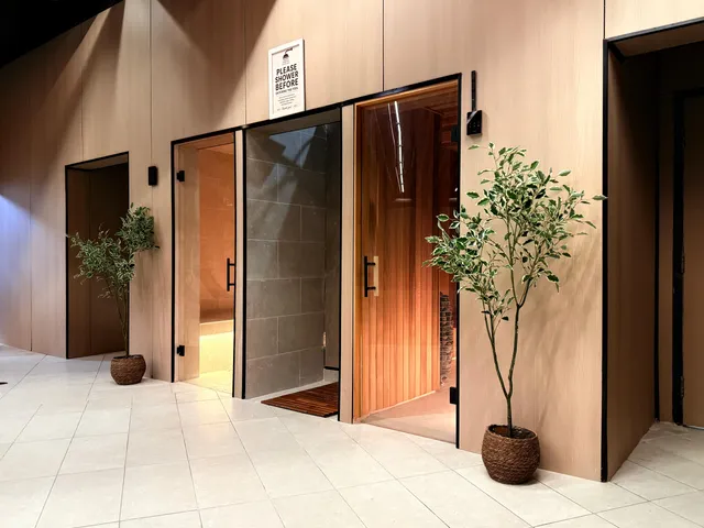 Locker room corridor with private changing suites