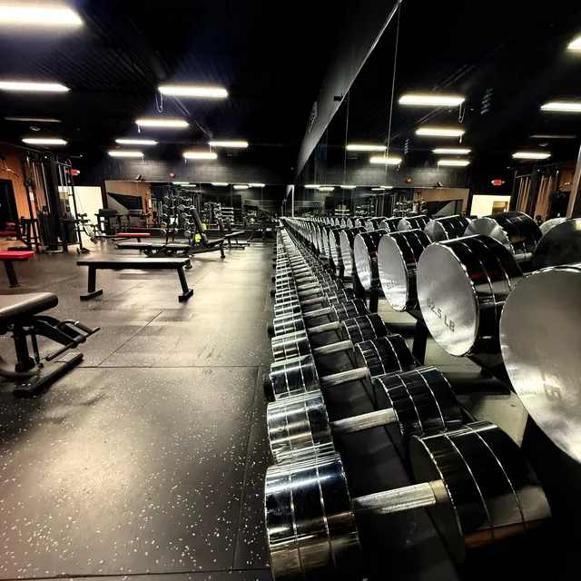 Dumbbell racks along the weight room wall