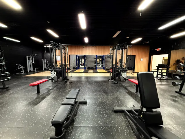 Benches and machines along the gym floor