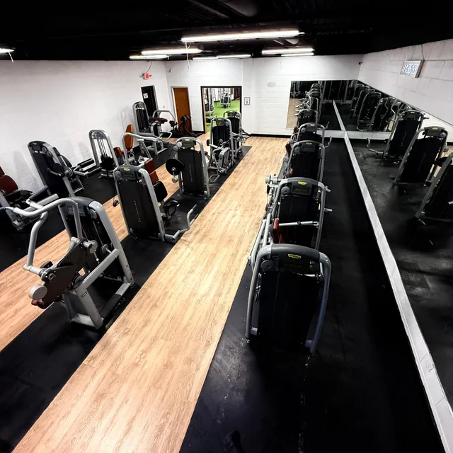 Cardio machines reflected in the gym mirror