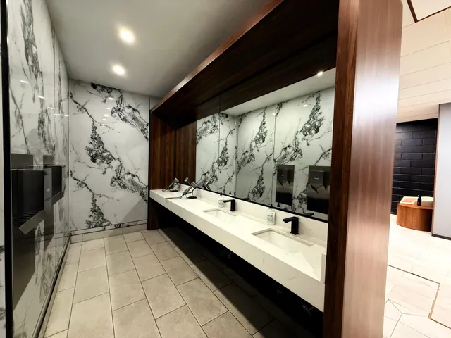 Washroom vanity in marble-tiled finish