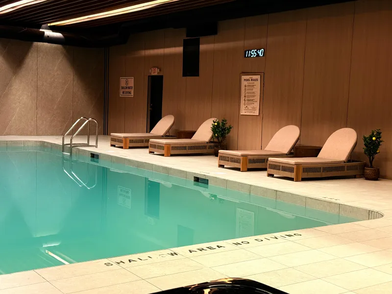 The pool deck in the Wellness Centre, lined with wooden loungers