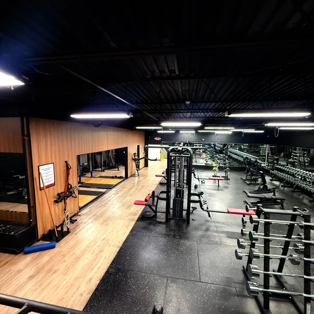 Gym floor reflected in the wall-length mirror